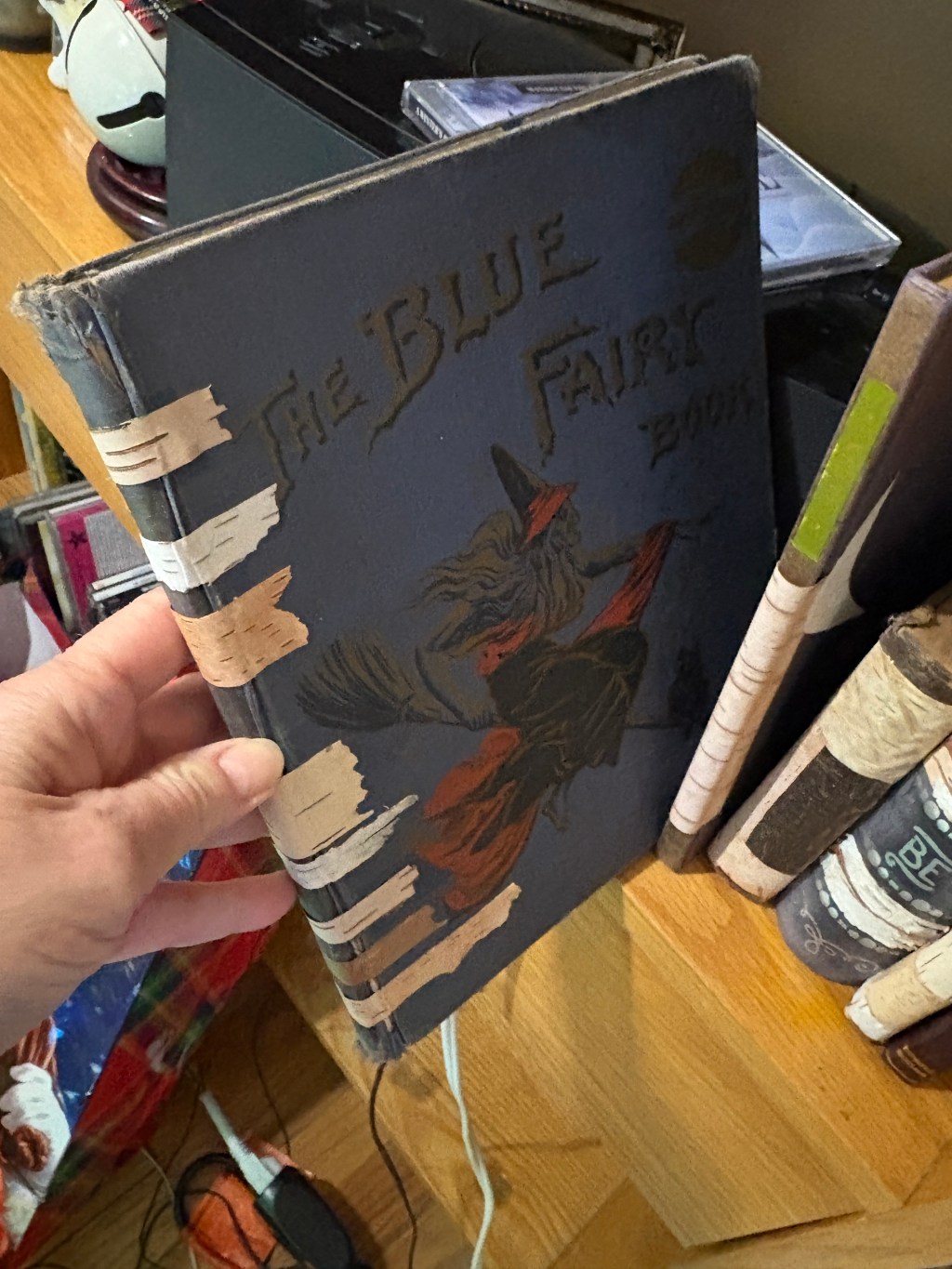 Book on shelf repaired with birch bark